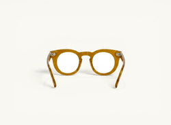 Anteojos ópticos Fibra Eyewear Gogo Premium en acetato color miel translúcido con diseño redondo estilo panto.
